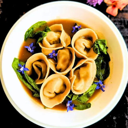 Pulled Beef Ravioli, Meat Jus & Sautéed Fresh Spinach