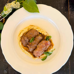 Beef steaks stuffed with vegetables and pork jowl, chickpea puree