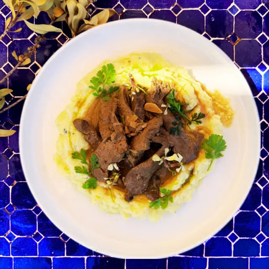 Beef liver with onions and fresh herbs, mashed potatoes, sautéed spinach