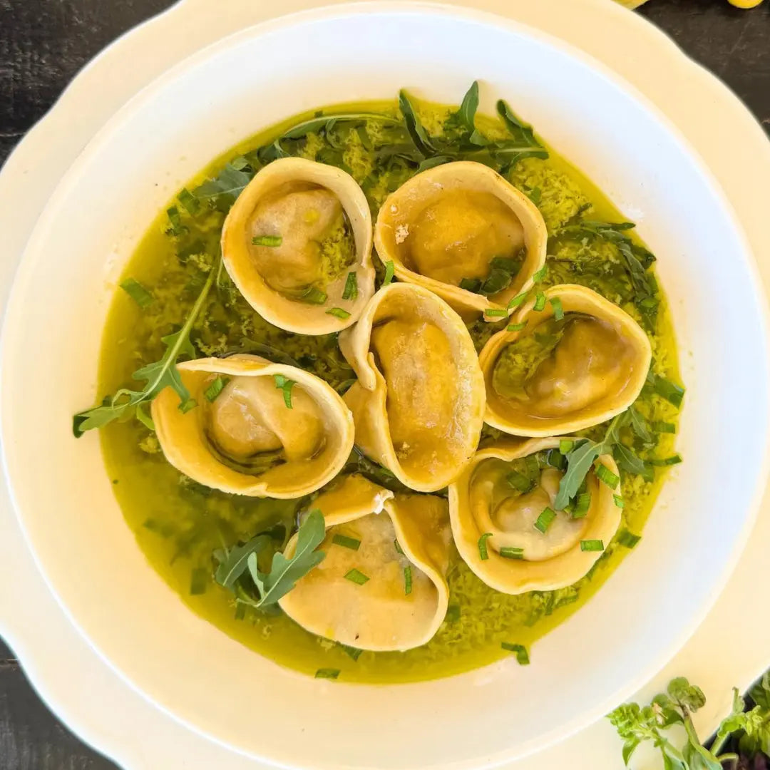 Langoustine tortellini, herb sauce.