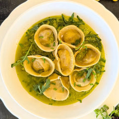 Langoustine tortellini, herb sauce.