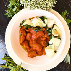 Sweet potato and cheese gnocchi, roasted bell pepper sauce.