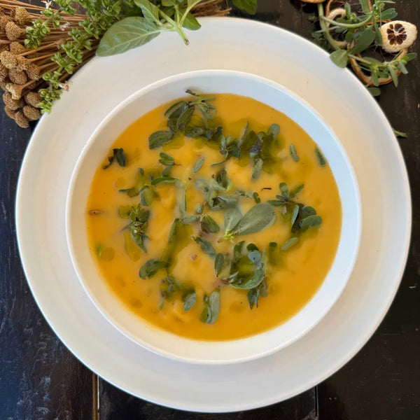 Roasted vegetable cream soup with leafy greens