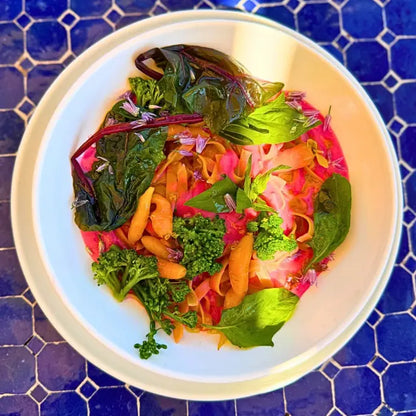 Fresh pasta with citrus beetroot sauce and steamed vegetables
