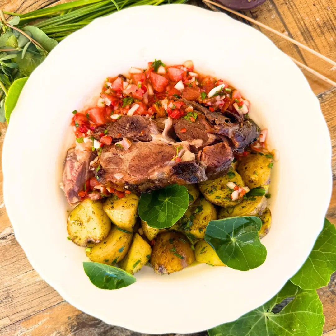 Slow-roasted Black Iberian Pork Neck with raw salsa and new potatoes