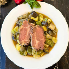 Slow-roasted black pork shoulder with summer vegetable stew.